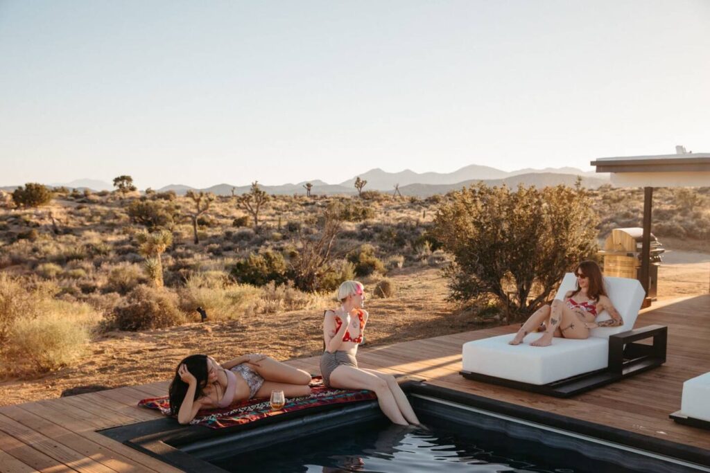 Airbnb guests lounging next to a Modpool enjoying one of the best Airbnb amenities a pool.