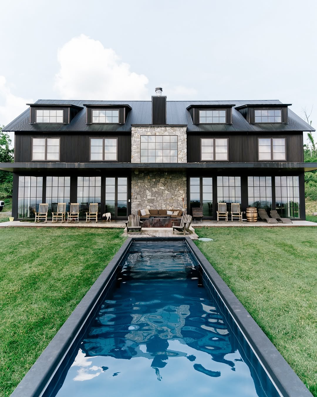 A container pool installed inground at a large modern home in Delaware